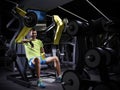 Happy young adult bodybuilder doing weight lifting in gym. Royalty Free Stock Photo