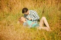 Happy young adult couple in love on the field. Two, man and wom Royalty Free Stock Photo