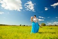 Happy young adult couple in love on the field. Two, man and wom Royalty Free Stock Photo