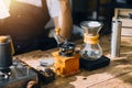 Happy young adult couple making breakfast and drinking coffee together in cozy home kitchen in morning at home. Preparing meal and Royalty Free Stock Photo