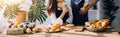 Happy young adult couple making breakfast and drinking coffee together in cozy home kitchen in morning at home. Preparing meal and Royalty Free Stock Photo