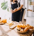 Happy young adult couple making breakfast and drinking coffee together in cozy home kitchen in morning at home. Preparing meal and Royalty Free Stock Photo