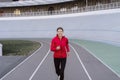 Young adult sporty girl  running on sport training in city Royalty Free Stock Photo