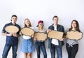 Happy young adults holding up copyspace placard thought bubbles