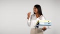 Happy young african american business woman calling by phone, talking, holding many folders Royalty Free Stock Photo