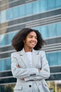 Happy young African American business woman standing in city feeling proud. Royalty Free Stock Photo