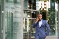 Happy young african american businessman talking on cell phone Royalty Free Stock Photo