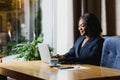 Happy young african american businesswoman using computer in office Royalty Free Stock Photo