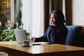 Happy young african american businesswoman using computer in office Royalty Free Stock Photo