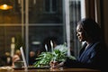 Happy young african american businesswoman using computer in office Royalty Free Stock Photo