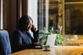 Happy young african american businesswoman using computer in office Royalty Free Stock Photo