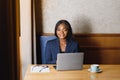 Happy young african american businesswoman using computer in office Royalty Free Stock Photo