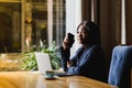 Happy young african american businesswoman using computer in office Royalty Free Stock Photo