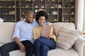 Happy young african american couple using tablet. Royalty Free Stock Photo