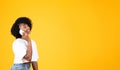 Happy young african american curly woman calling by smartphone, talking to friend Royalty Free Stock Photo