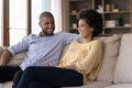 Happy young african american family couple talking at home. Royalty Free Stock Photo