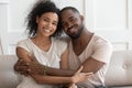 Happy young smiling cuddling african american family portrait. Royalty Free Stock Photo