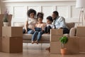 Happy black family with kids relax on sofa with tablet Royalty Free Stock Photo