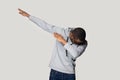 Happy young african american guy in sportswear making dab gesture. Royalty Free Stock Photo