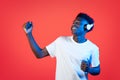 Happy young african american guy using wireless headphones Royalty Free Stock Photo