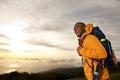 Happy young african american man with backpack walking in mountains Royalty Free Stock Photo