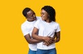 Happy young african american man hugging his smiling girlfriend Royalty Free Stock Photo