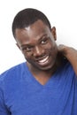 Happy young African American man looking away against white background Royalty Free Stock Photo