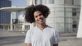 Happy young African-American man looking at the camera with smiling.