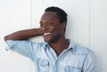 Happy young african american man smiling against white background Royalty Free Stock Photo