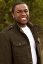 Young African American man smiling outside. Royalty Free Stock Photo