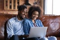 Happy young African American couple using computer. Royalty Free Stock Photo