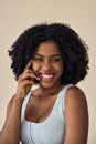 Happy young African American woman beauty model at beige background. Portrait. Royalty Free Stock Photo