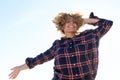 Happy young african american woman laughing with hand in hair outside Royalty Free Stock Photo