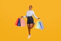 Happy young african american woman with shopping bags Royalty Free Stock Photo