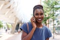 Happy young african american woman talking on cellphone in the city Royalty Free Stock Photo