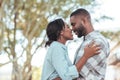 Affectionate young African couple smiling at each other outside Royalty Free Stock Photo