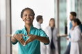 Happy young African doctor woman showing hand heart Royalty Free Stock Photo