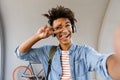 Happy young african man with backpack outdoors Royalty Free Stock Photo