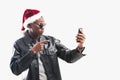 Young african man with Cell Phone at christmas time Royalty Free Stock Photo