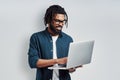 Happy young African man in eyewear