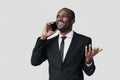 Happy young African man in formalwear