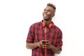 Happy young african man with headphones and mobile phone Royalty Free Stock Photo