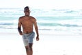 Happy young african man walking at the beach Royalty Free Stock Photo