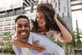 Happy young african man and woman in park posing together at camera. Royalty Free Stock Photo