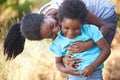 Ive got you. A happy young african mother spending time with her daughter while outdoors in nature. Royalty Free Stock Photo