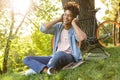 Happy young african teenager with backpack outdoors Royalty Free Stock Photo