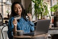 Happy young african woman holding credit card Royalty Free Stock Photo