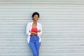 Happy young african woman looking away and smiling Royalty Free Stock Photo