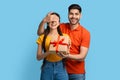 Happy young arab man surprising his girlfriend with present, covering her eyes Royalty Free Stock Photo