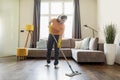 Happy Young Arab Woman Cleaning Living Room And Listening Music Royalty Free Stock Photo